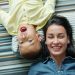happy mom and son lying on a striped carpet